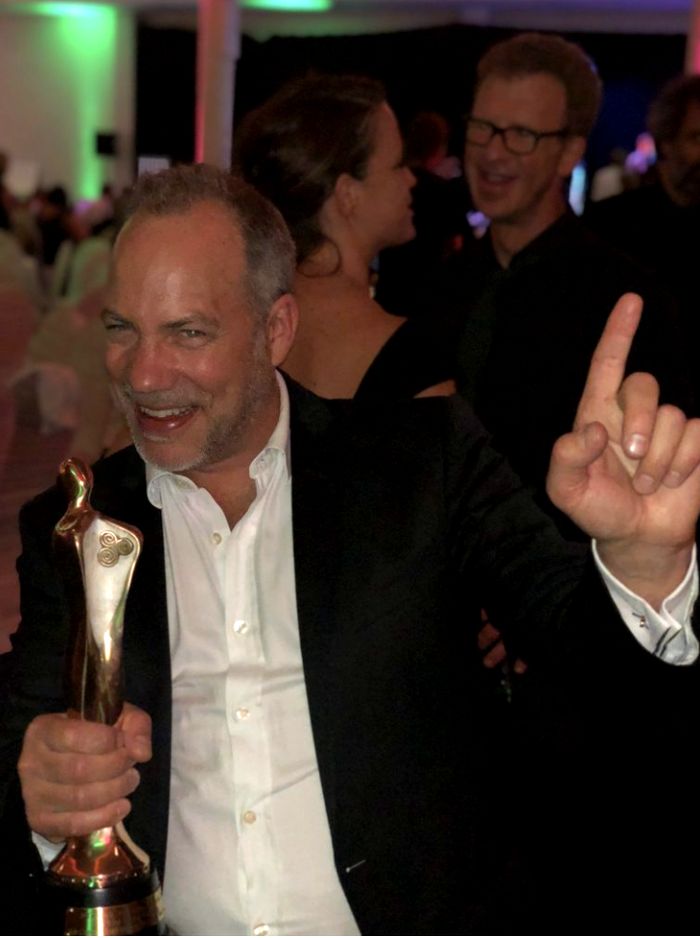 Bob Caldwell holding his IFTA award at the ceremony